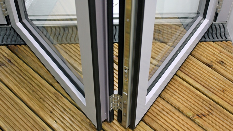 Photo of bifold doors in Bradford showroom, illustates dual rubber seals to door panels